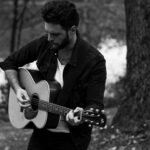 JD Eicher playing guitar