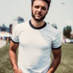 JD Eicher In white t-shirt, jeans